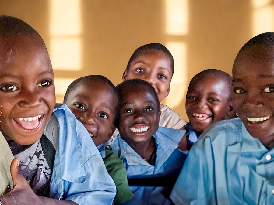young kids at school smiling at camera