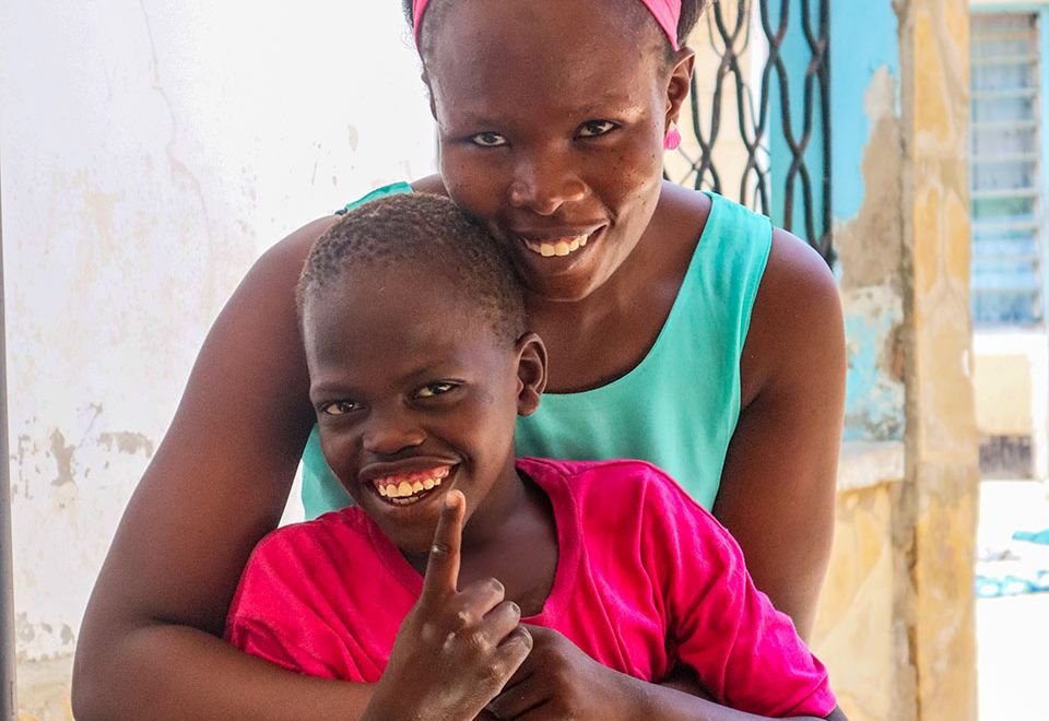 support worker hugs child