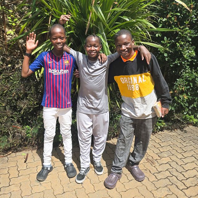 school boys waving