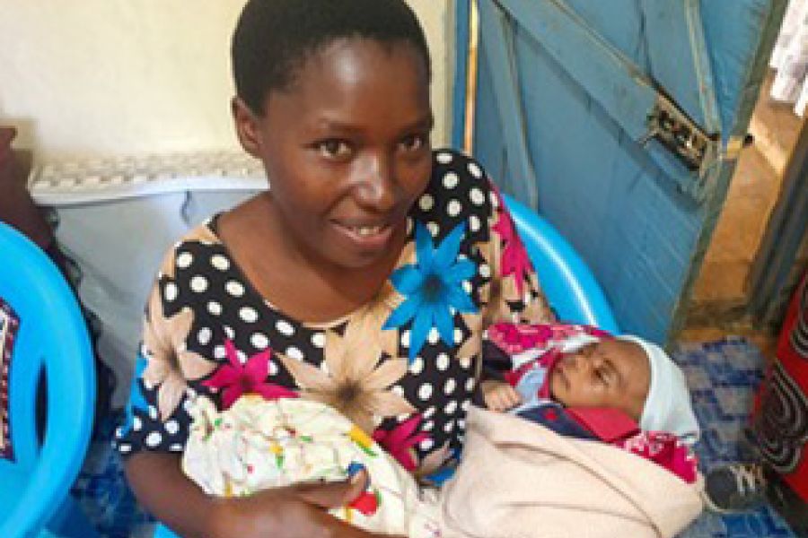woman holds young baby